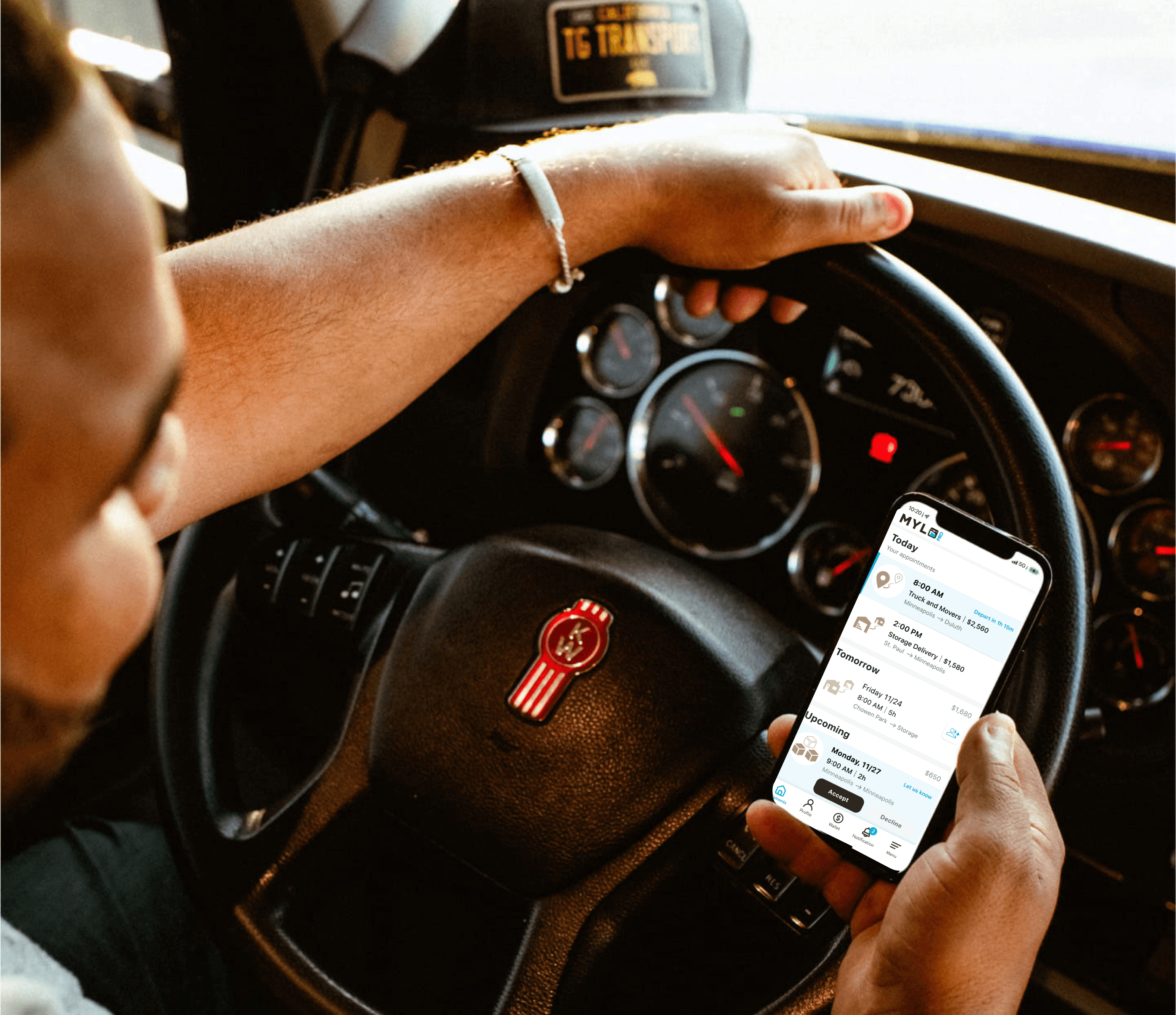 A MYLO driver checking his next shipment in the MYLO Pro app